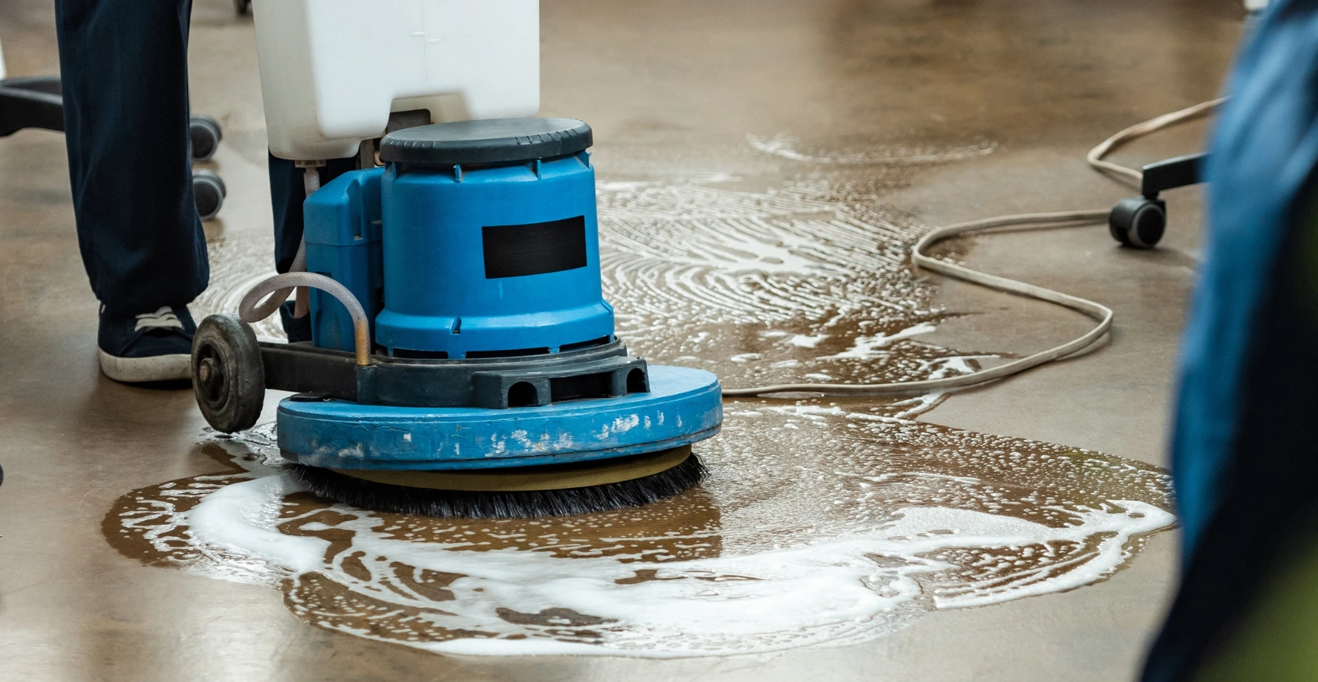 Close-up of industrial cleaning task like high dusting, graffiti removal, or steam cleaning